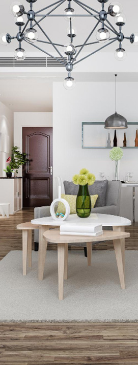 Großzügiges Wohnzimmer mit hellen Wänden, Fischgrätparkett, Designmöbeln und Blick in den Essbereich.